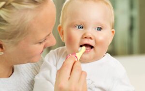 when to start brushing baby teeth